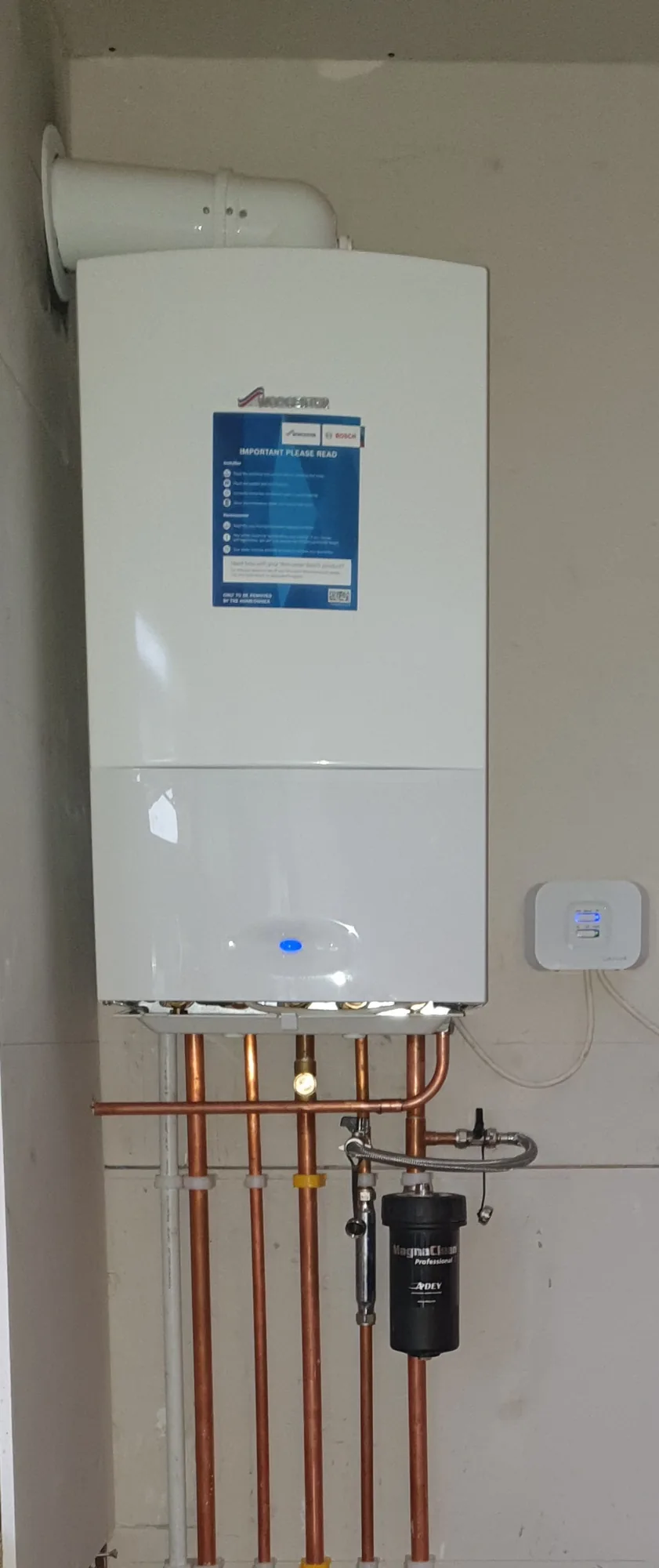 Newly installed Worcester Bosch gas combi boiler with clean pipework